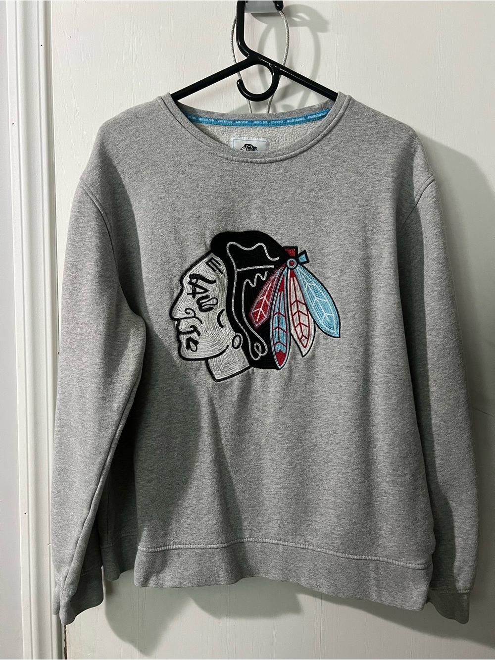 Classic Grey Crewneck Sweatshirt with Feather Patch
